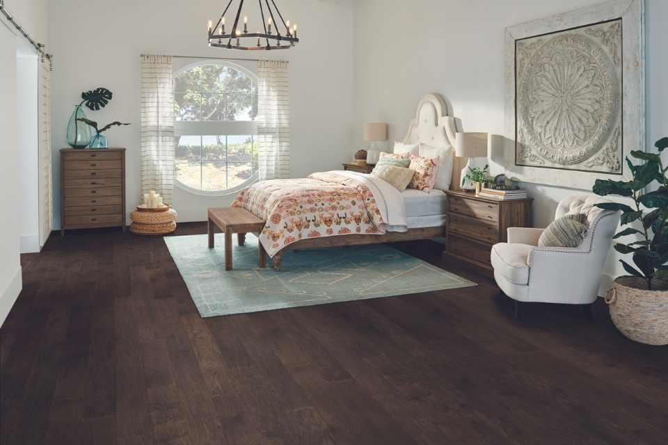 rich dark hardwood in bedroom with mid-century modern vibe